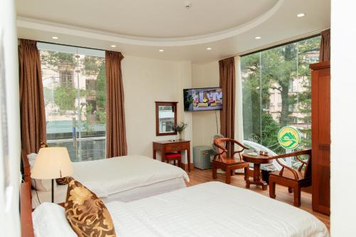Ένα ή περισσότερα κρεβάτια σε δωμάτιο στο Eden Tam Dao Hotel - Lovely Hotel in Tam Dao