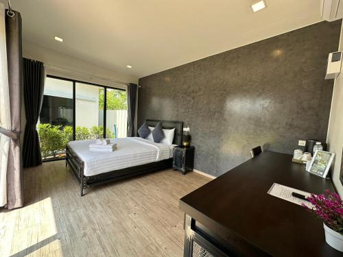 En eller flere senge i et værelse på Na Khonglong