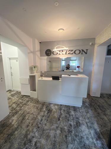 a salon with a white counter and a mirror at HORIZON in Ustka