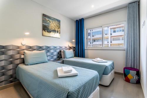 Ένα ή περισσότερα κρεβάτια σε δωμάτιο στο Emerson Plaza stunning 2 bedroom apartment with sea view