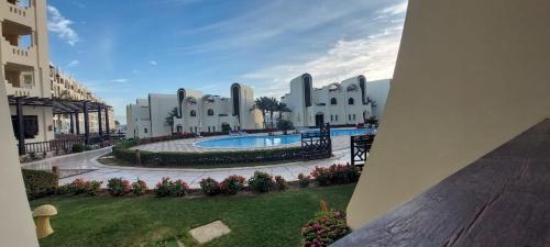 a view of a resort with a swimming pool at Buki-Gravity-Homes, App No1, amazing spacy beachfront apartment in 5 star hotel Gravity Sahl Hasheesh in Hurghada