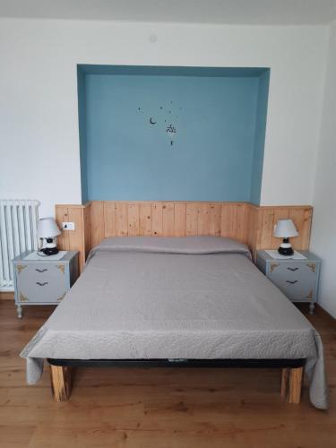 En eller flere senge i et værelse på Appartamento a 1000 metri