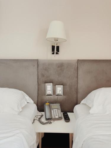 Una cama o camas en una habitación de Ruby Palace