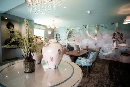 a dining room with a vase on a table at The Ruddings in Keswick