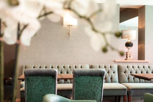 a dining room with a table and two chairs at The Ruddings in Keswick