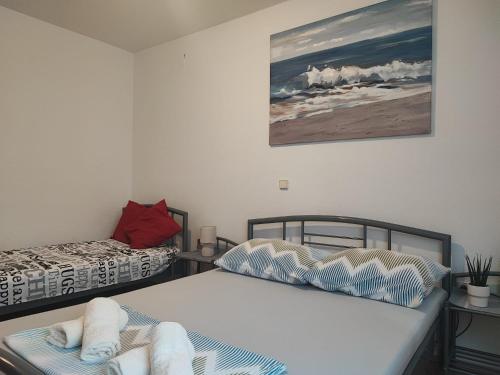 a room with two beds in a room at Apartman Luka in Vodice