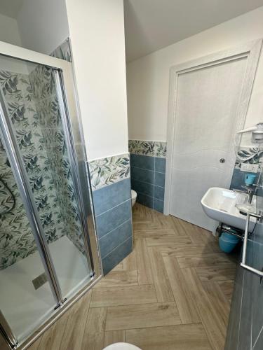 a bathroom with a shower and a sink at Ametista Rooms Tropea in Tropea