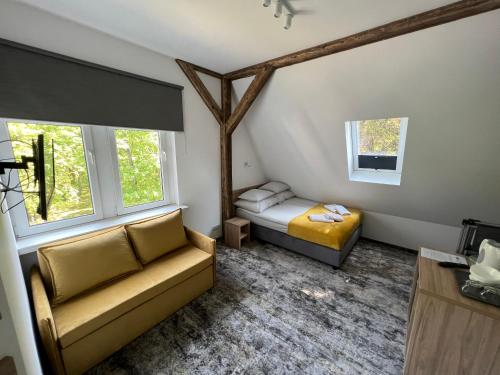 a bedroom with two beds and two windows at HORIZON in Ustka
