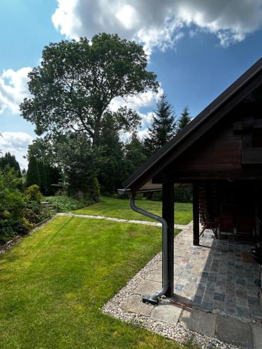 a porch of a house with a gazebo at log cabin in Czech-Saxon Switzerland in Šluknov
