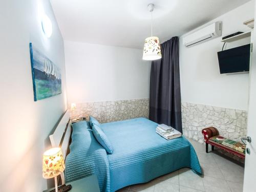 TV a/nebo společenská místnost v ubytování Il Giunco B&B