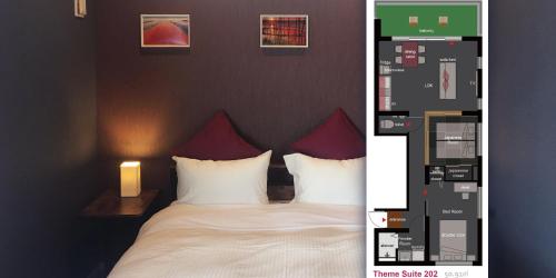 a bedroom with a bed with white sheets and red pillows at SOU東恩納 in Uruma