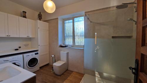 a bathroom with a toilet and a sink and a shower at Villa Sicels - Agnone Beach - Syracuse in Agnone Bagni