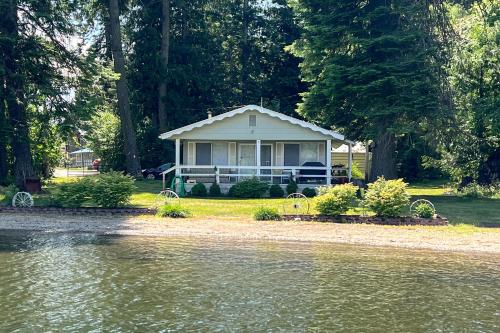 a house sitting on the shore of a body of water at Twin Lakes Gem in Rathdrum