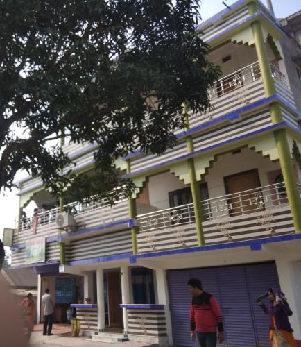 a man standing in front of a building at Babusona Homestay in Jaldapara in Mādāri Hāt