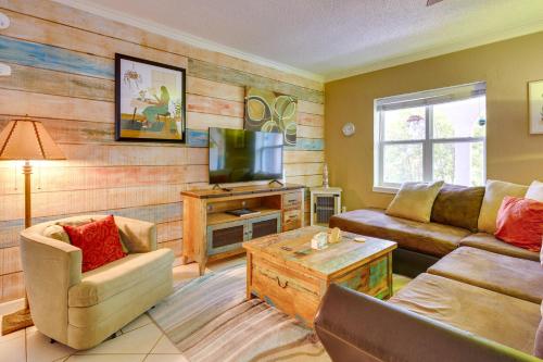 a living room with a couch and a tv at Deck, Fire Pit and Grill Port Isabel Home! in Port Isabel