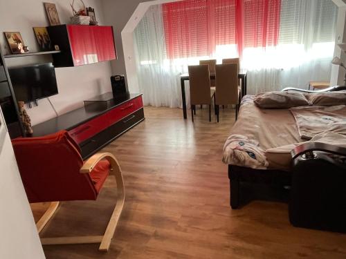 a bedroom with a bed and a table and chairs at Erinati in Sulina