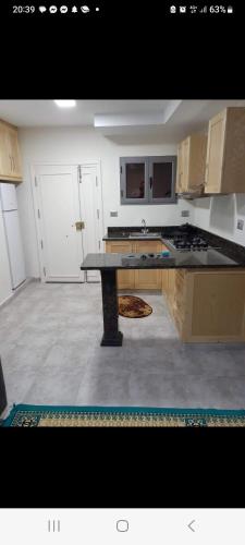 a kitchen with a large counter top in a room at Residence djerba 3 in Houmt Souk