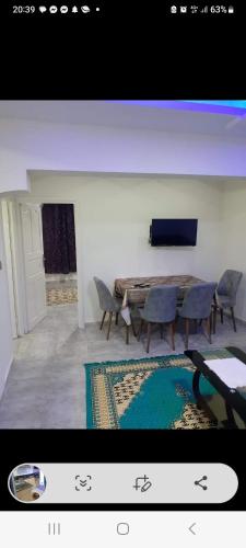 a picture of a dining room with a table and chairs at Residence djerba 3 in Houmt Souk