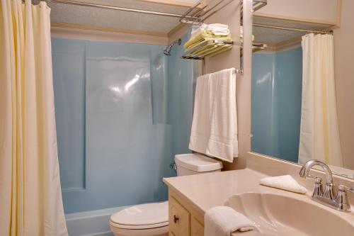a bathroom with a sink and a toilet and a shower at Lakefront Cadiz Home with Hot Tub! in Cadiz