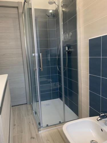 a bathroom with a glass shower and a sink at Casa Castellana Apt 1 e Casa Castellana Apt 2 in Sala Comacina