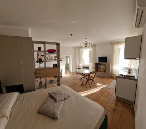 a bedroom with a bed and a table in a room at Casa Myrtifolia in Todi