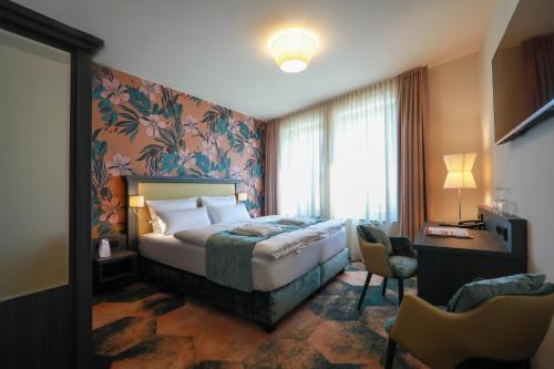 Postel nebo postele na pokoji v ubytování SPREE. Hotel am Hafen
