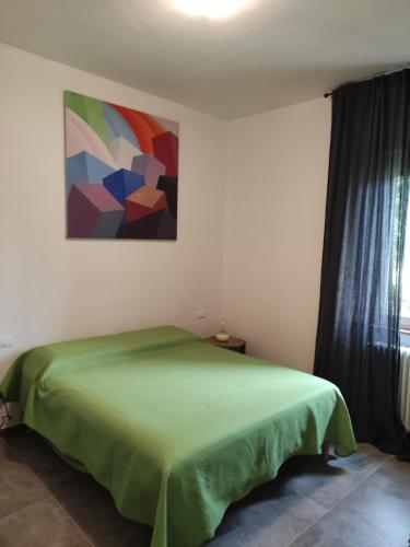 Postel nebo postele na pokoji v ubytování Appartamento Il Picchio Verde