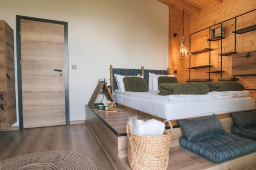 a bedroom with a bed and a couch and a chair at Dakota forest retreat in Tsigov Chark