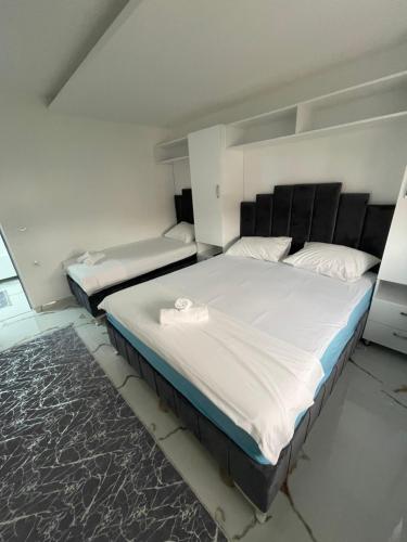 a bedroom with two beds in a room at Draga in Ulcinj