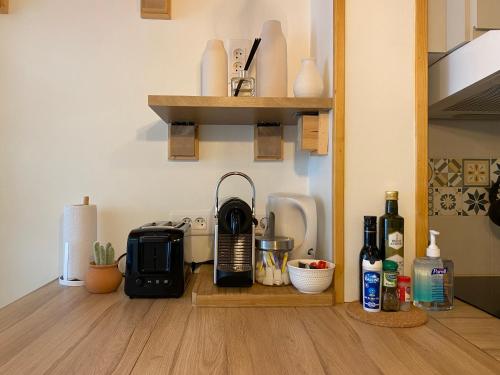 a kitchen with a coffee maker on a wooden counter at Proche de la vieille ville et des plages, et parking GRATUIT ! in Antibes