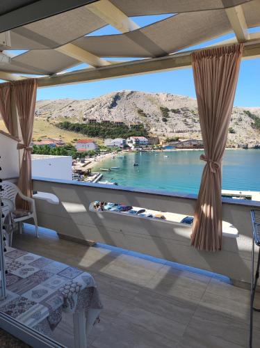 a room with a view of the water at Apartments Katica in Metajna