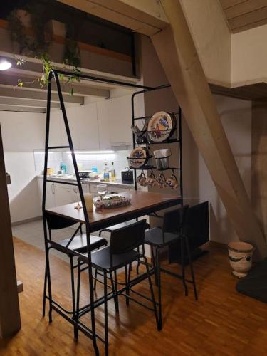 a kitchen with a table and chairs in a room at The St.Gallen Feel in St. Gallen