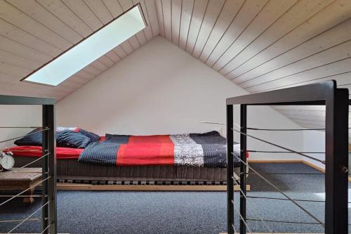 a bed in a room with a roof at The St.Gallen Feel in St. Gallen