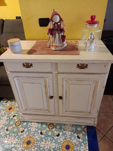 a white table with two dolls on top of it at Home Il Cortiglione in Frascati