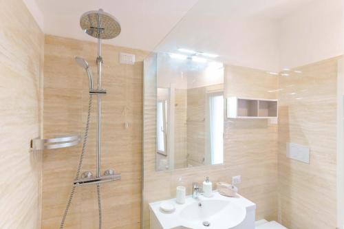 a bathroom with a sink and a shower at B&B Villa Zola in Capoterra