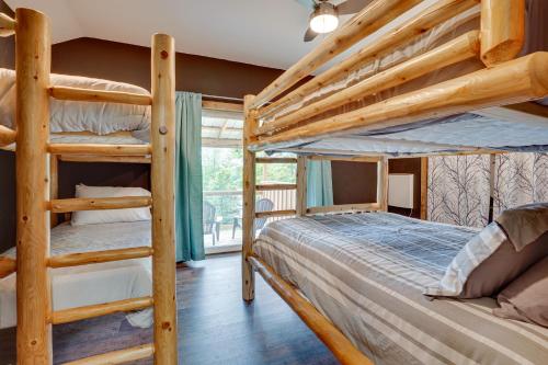 a bedroom with two bunk beds in a cabin at Secluded Marathon Hideaway w/ Fire Pit + Views! in Marathon