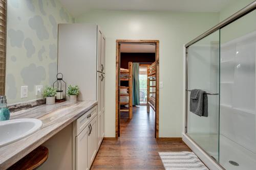 a bathroom with a sink and a glass shower at Secluded Marathon Hideaway w/ Fire Pit + Views! in Marathon