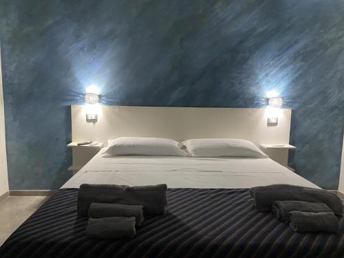 Posteľ alebo postele v izbe v ubytovaní Akoya Rooms Capo Vaticano