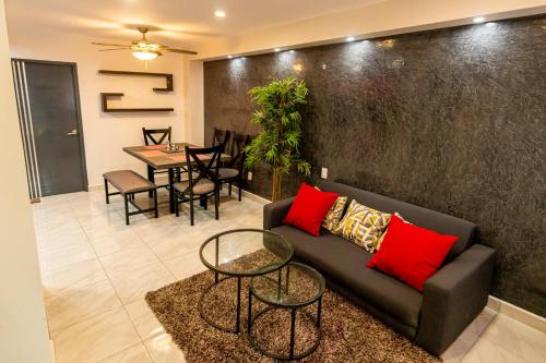 a living room with a couch and a table at Flamingo 45 in Ixtapa