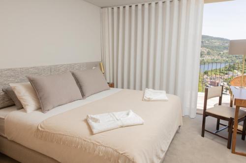 Ein Bett oder Betten in einem Zimmer der Unterkunft QUINTA ALTO DO RIO