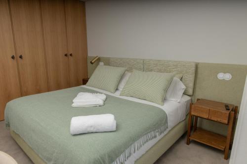 Een bed of bedden in een kamer bij QUINTA ALTO DO RIO