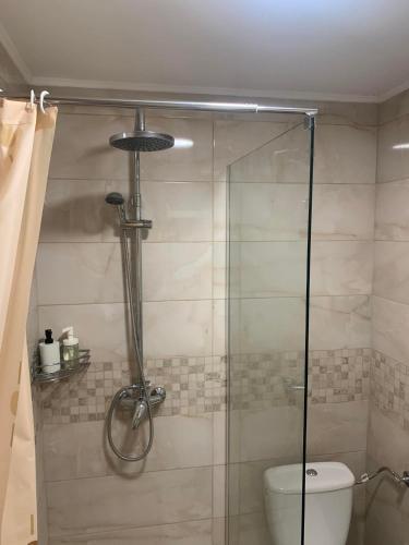 a bathroom with a glass shower with a toilet at Rajski Horizonti - Rooms Ram I in Ram