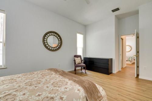 a bedroom with a bed and a dresser and a mirror at 4 Mi to Rainbow Springs Dunnellon Villa with Pool! in Dunnellon
