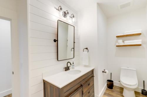 a bathroom with a sink and a mirror at Orangeville Vacation Rental with On-Site Creek! in Orangeville