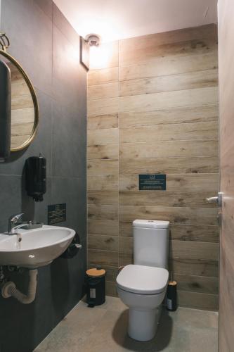 a bathroom with a toilet and a sink at Dakota forest retreat in Tsigov Chark
