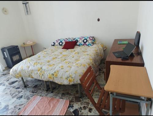 a bedroom with a bed and a desk with a laptop at 1 Room(2 Beds)Messina, Ganzirri in Messina