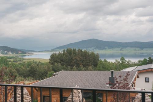a view of a lake from a house at Dakota forest retreat in Tsigov Chark