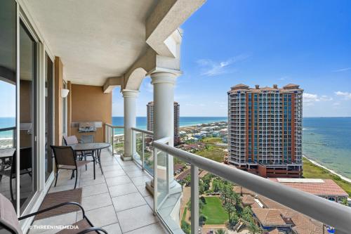 a balcony with a view of the ocean at Amazing WATERVIEW in every room, PORTOFINO Island Resort condo in Pensacola Beach