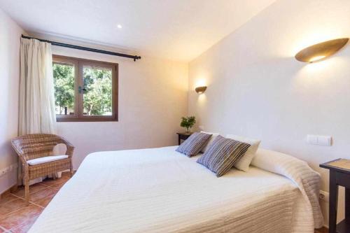 A bed or beds in a room at Finca Cas Contador Mallorca