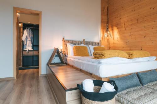 a bedroom with a large bed and a couch at Dakota forest retreat in Tsigov Chark